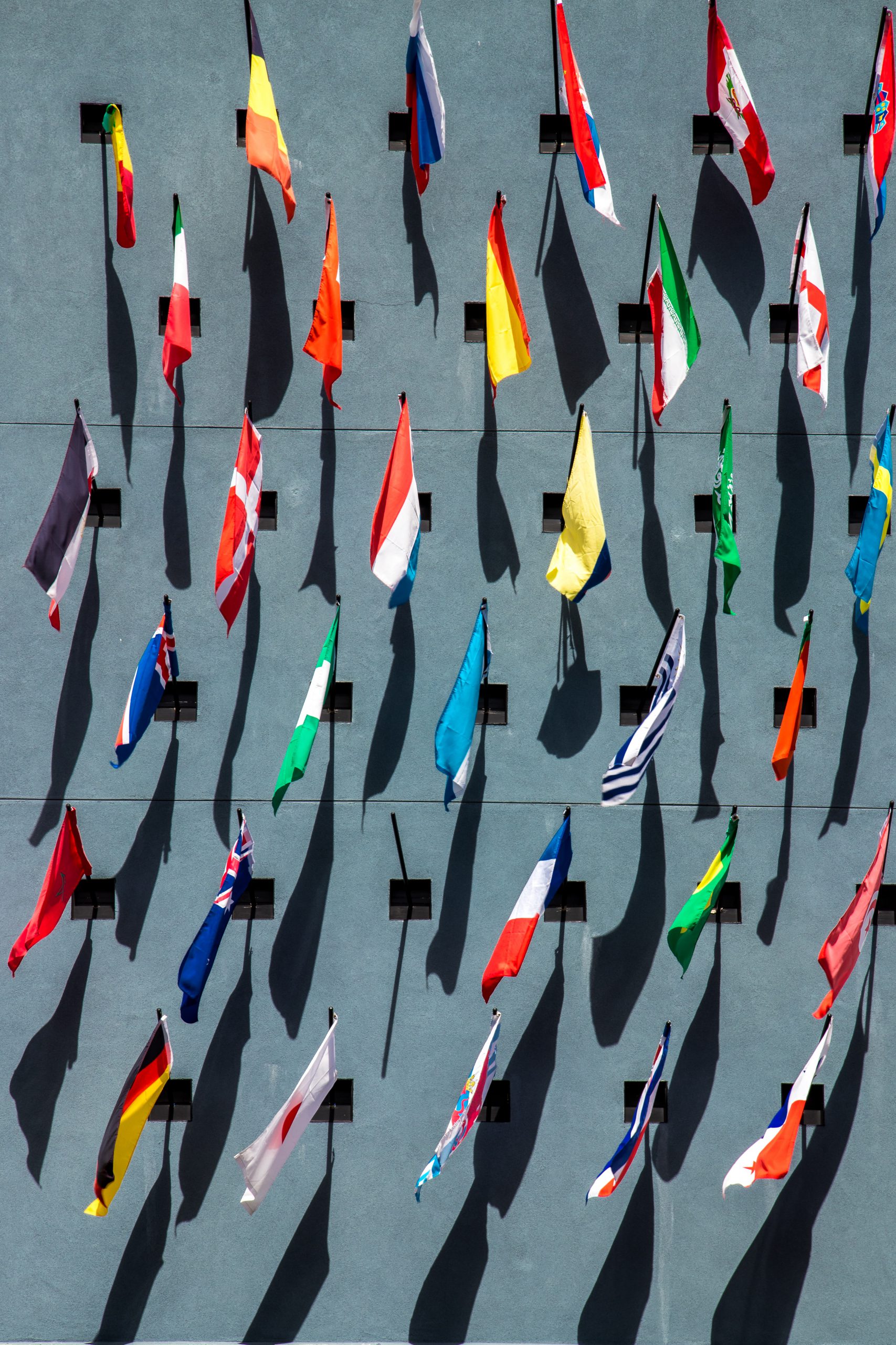photo-of-assorted-color-nation-flags-on-wall-during-daytime-stockpack-unsplash.jpg