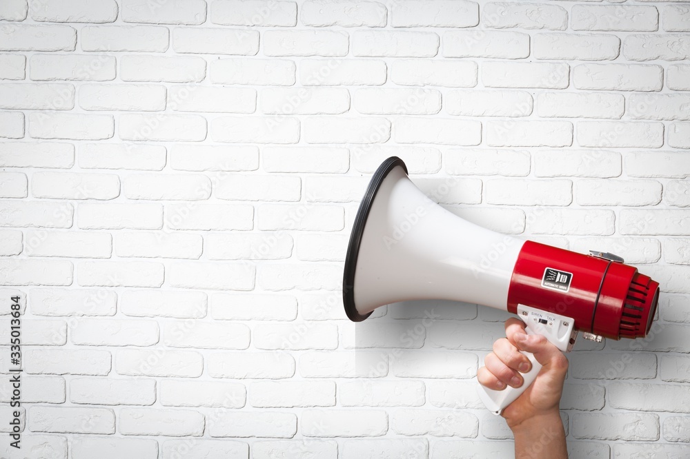 human-hand-hold-the-classic-megaphone-stockpack-adobe-stock